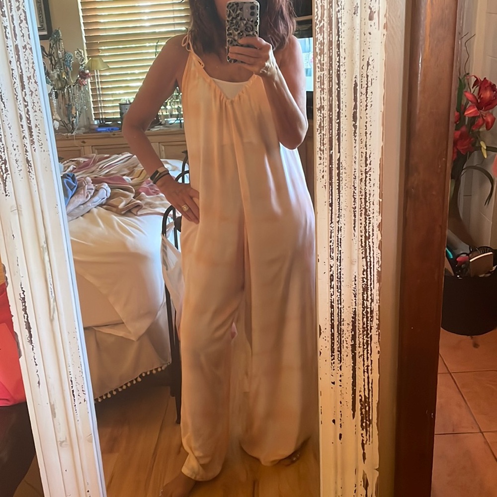 Flowy and roomy jumpsuit.  Worn one time. Like brand new.  Peach colored